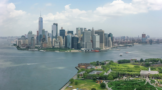 Aerial shot approaching Lower Manhattan from the Governors Island. Shot in New York, USA.