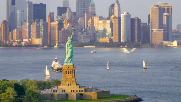 istock Statue of Liberty and Lower Manhattan in sunshine 951879652
