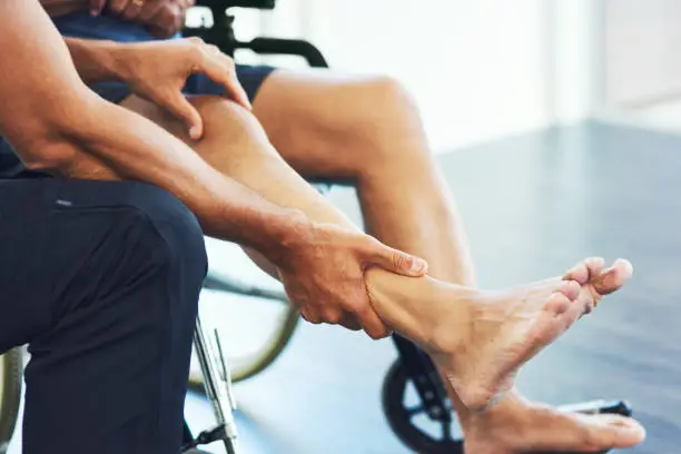 Cropped shot of an unrecognizable male physiotherapist assisting a senior patient in recovery