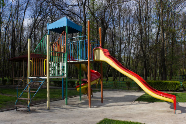 istock Deserted kid slide in a park 951890516