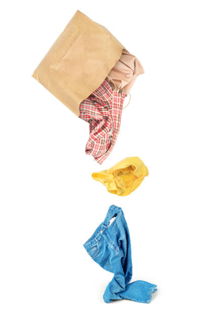 istock Clothes falling out of the package isolated on white background 951896154