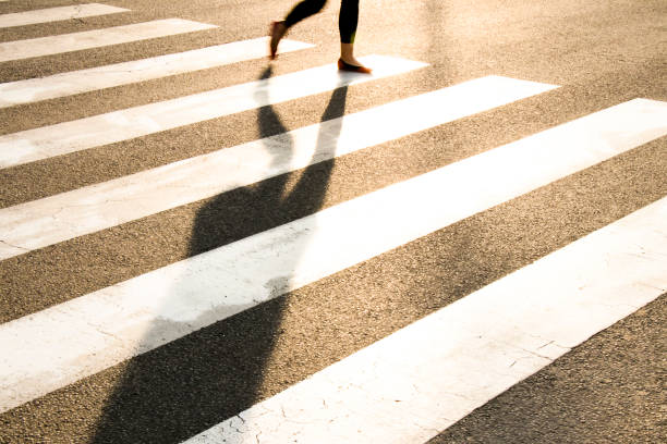 istock one pedestrian crossing the street 951896278