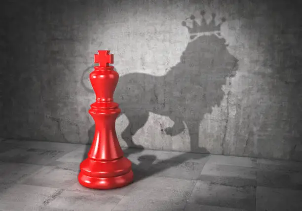 Photo of Leader concept. Headman. Chess king cast shadow in form of lion with crown. 3d illustration