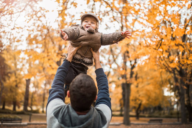 istock Happy little boy having fun with his father in the park. 951904340