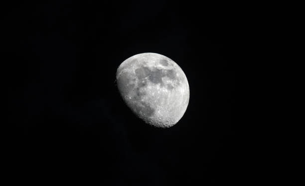 three quarter moon in great detail in a black night sk three quarter moon in great detail in a black night sky in April apollo 11 stock pictures, royalty-free photos & images