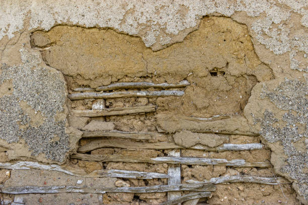 istock Aged grunge wall of mud and slats as a  background 951912116