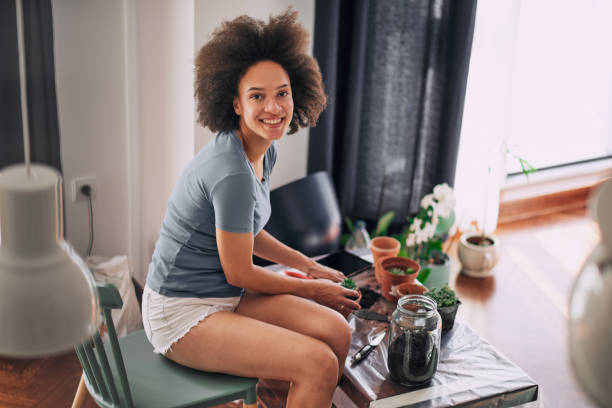 istock Beautiful mixed race woman gardening. 951914192
