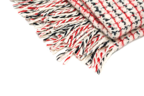 istock Checkered woolen plaid with tassels isolated on white background, close-up 951917500