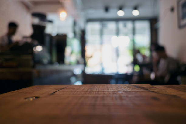 istock Wooden table in cafe with blur bokeh vintage background 951917664