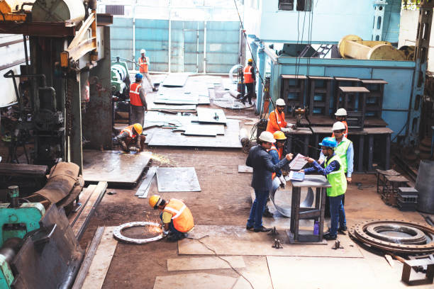istock High angler view of a factory in work. 951924696