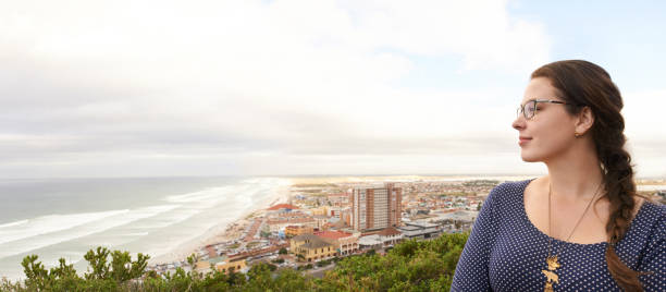 Shot of a young woman admiring the view while on vacation at the coast