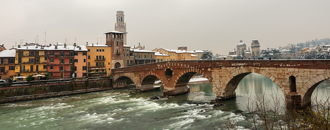 Ponte Pietra (Stone bridge) - 1st century B.C. - the oldest Roman monument in Verona (UNESCO world heritage site) and the Adige river in winter - Veneto - Italy - Europe