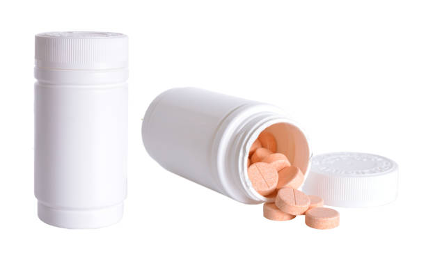 istock White medical container with pills isolated on white background 951927910