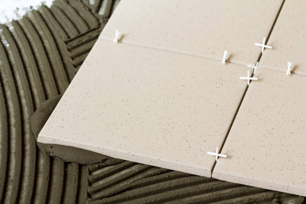 istock Ceramic tiles and tools for tiler. Floor tiles installation. Home improvement, renovation - ceramic tile floor adhesive 951928482