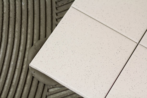 istock Ceramic tiles and tools for tiler. Floor tiles installation. Home improvement, renovation - ceramic tile floor adhesive 951928490
