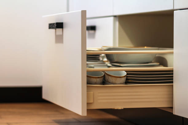 istock Open kitchen drawers with plates and cups dishes 951928776