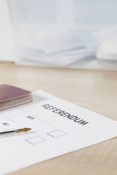 istock Referendum ballot paper, black pen, and passport on the table. 951929404