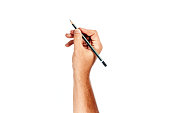 A man's hand holds a black pencil on a white background, isolate.