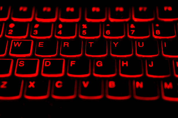 English language laptop keyboard with glowing red light