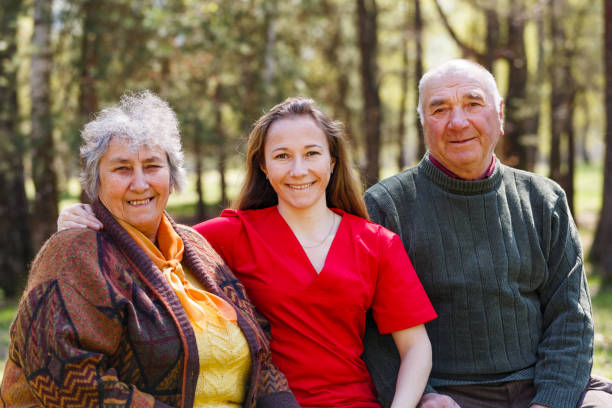 istock Elderly couple and young caregiver 951933654