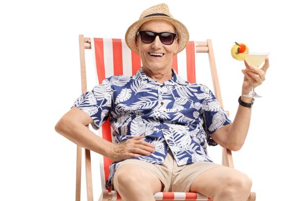 istock Old tourist with a cocktail sitting in a deck chair 951936888