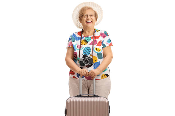 istock Female elderly tourist with a suitcase 951936920