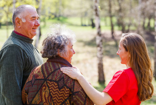 istock Elderly couple and young caregiver 951937758