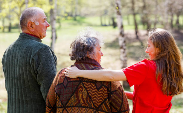 istock Elderly couple and young caregiver 951937896
