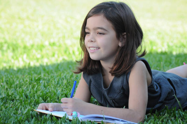 istock girl studying outdoors 951938190