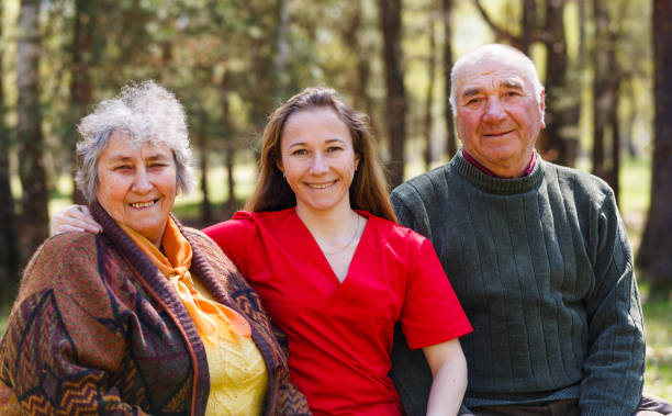 istock Elderly couple and young caregiver 951942792