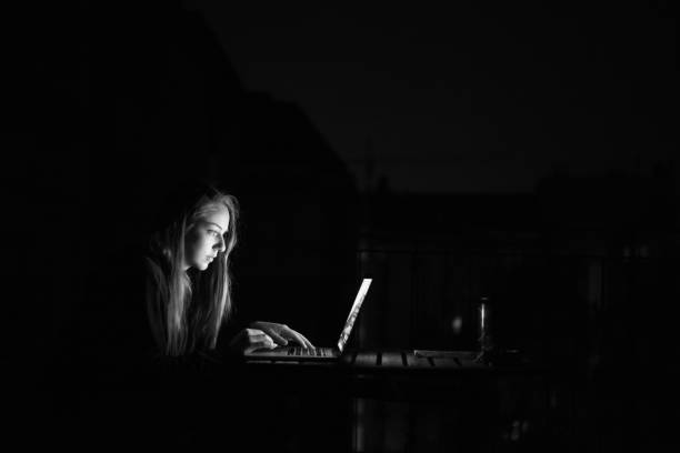 istock Woman working in the dark 951946572