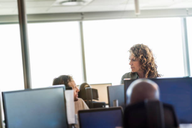 istock Professionals discussing at desk in office 951947402