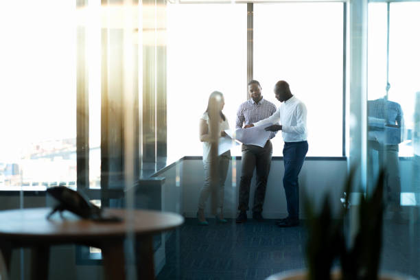 istock Business people with documents seen through glass 951951276