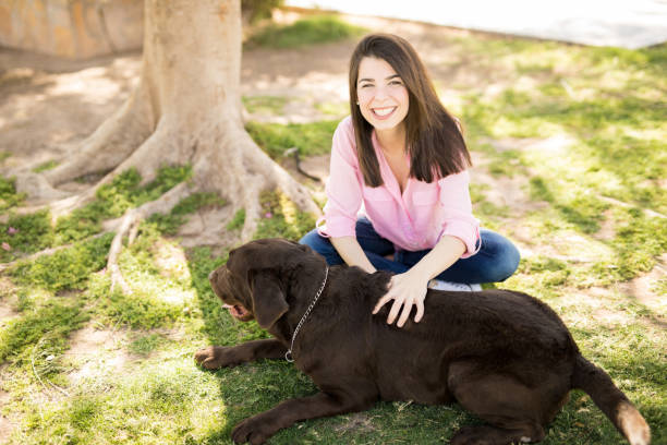 istock Beautiful woman with a dog 951952076