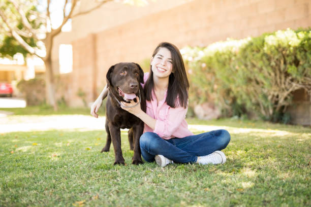 istock Cheerful woman with pet dog 951956044