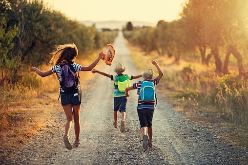 It's Vacations! Three kids running on last day of school. 
Nikon D810