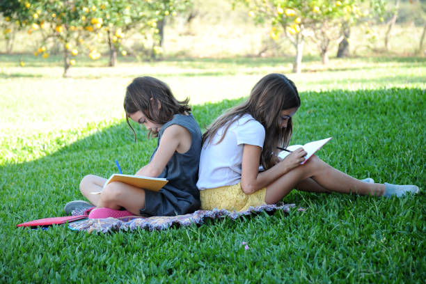 istock girls studying outdoors 951959918