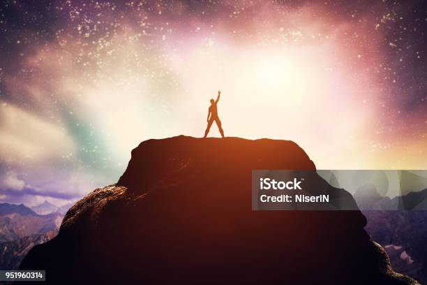 Excited Man Standing On The Peak Of A Mountain Stock Photo - Download Image Now - Conquering Adversity, Standing, Strength