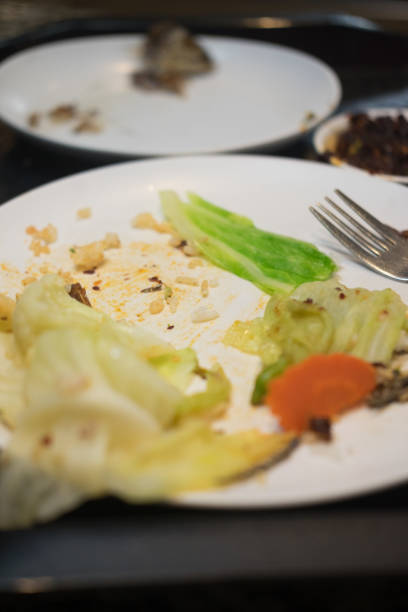 istock Dirty plates after eating with scrap food (close up) 951960622