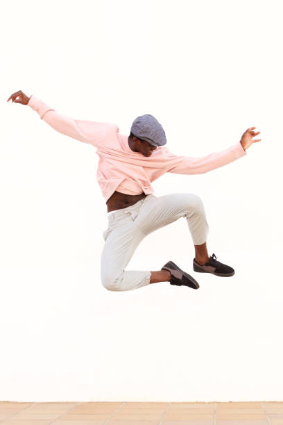istock young male dancer jumping on white background 951961782