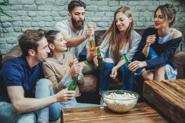 istock Five friends sitting at the sofa 951968294
