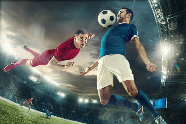 istock Two men are playing soccer and they compete with each other 951968352