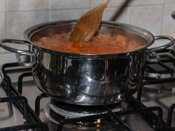 istock Metallic Pot with Italian Style Tomato Sauce. 951969106