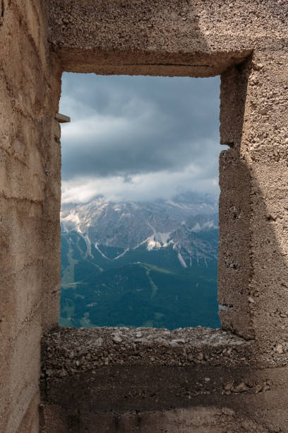 istock Cloudy Sky and Mountains View from a Window in Italian Dolomites Alps 951969290