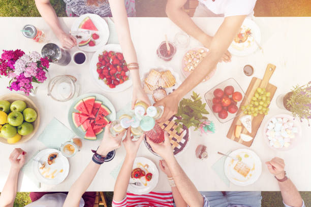 istock Mixed-race group eating outdoors 951969342