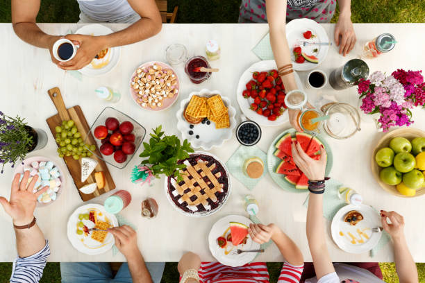 istock Students having a meal outdoors 951969370