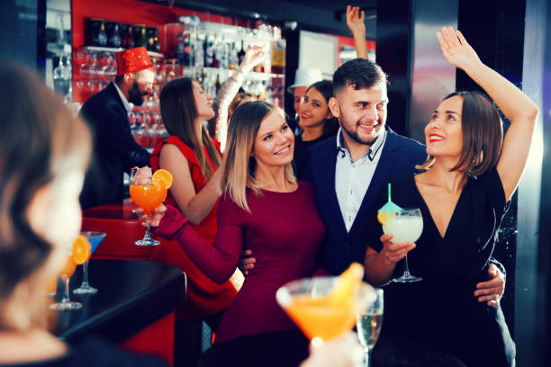 istock Guy with two girls partying in bar 951969608