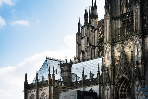 Cologne, Germany—Apr 23, 2024: teenagers sitting in front of Cologne Cathedral