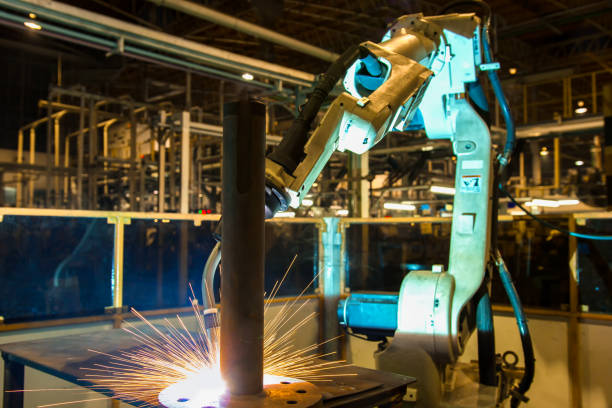 istock Robot is welding part in automotive factory 951978548