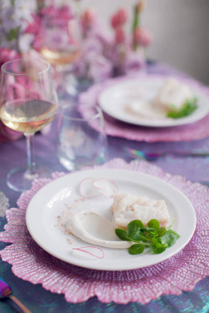 istock Festive table decor. Luxury wedding, party, birthday. View from above. Different seafood. White wine, prawns, fish. multicolored, Pink Lavender, Arcadia, Ultra Violet. flowers, carnations, roses. 951978704